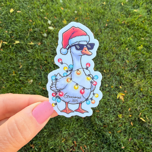 Goose Goosemas 2025 Santa Hat Goose Wearing Sunglasses Wrapped in Christmas Lights Vinyl Sticker Slap 3" x 1.8" Matte Finish