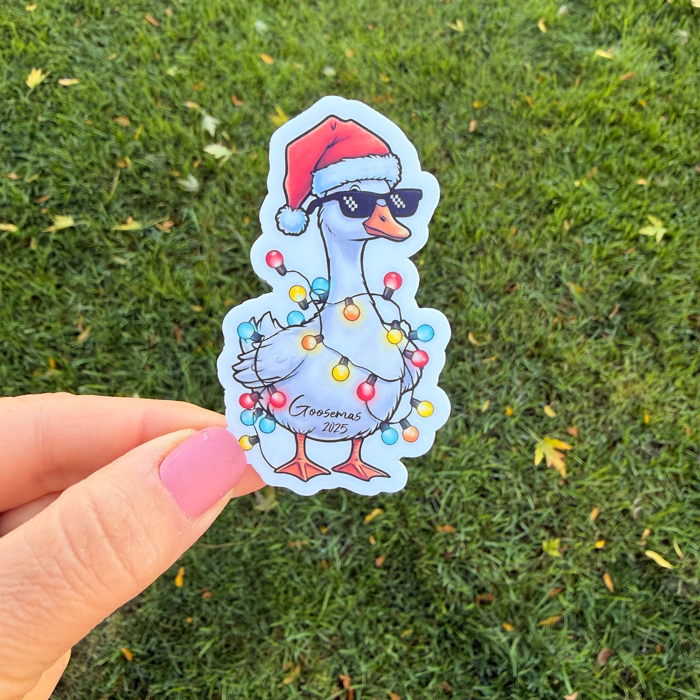 Goose Goosemas 2025 Santa Hat Goose Wearing Sunglasses Wrapped in Christmas Lights Vinyl Sticker Slap 3" x 1.8" Matte Finish